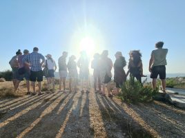 photo of alumni looking into the sun